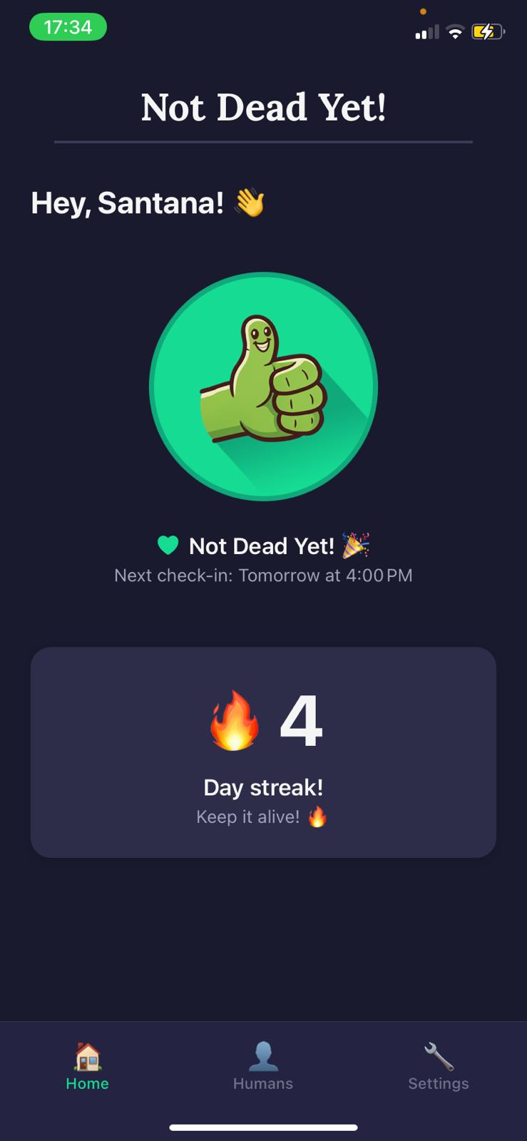 Not Dead Yet! main check-in screen — big green thumbs-up button with streak counter and check-in status